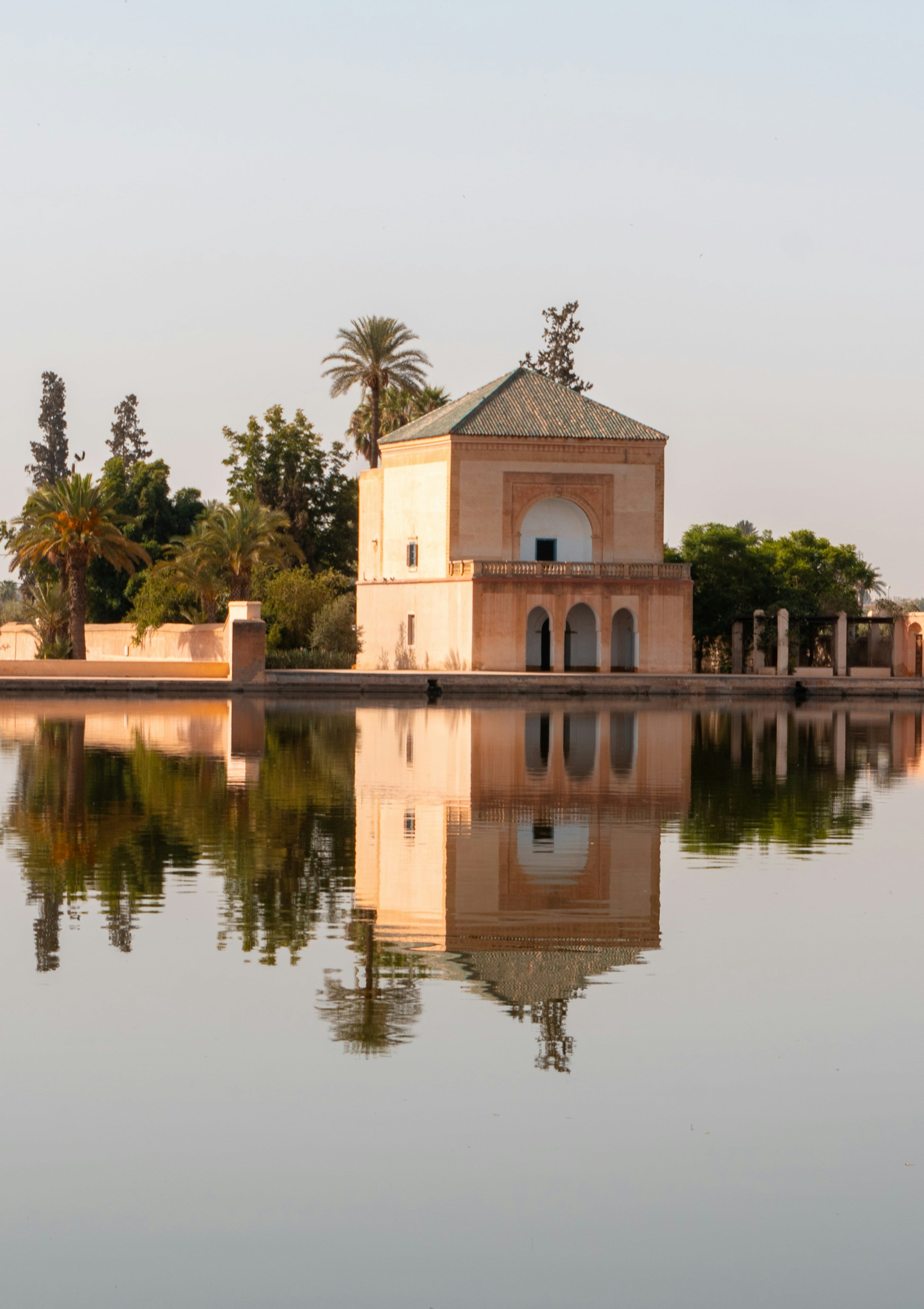 A garden pavilion reflected in its basin, Marrakech