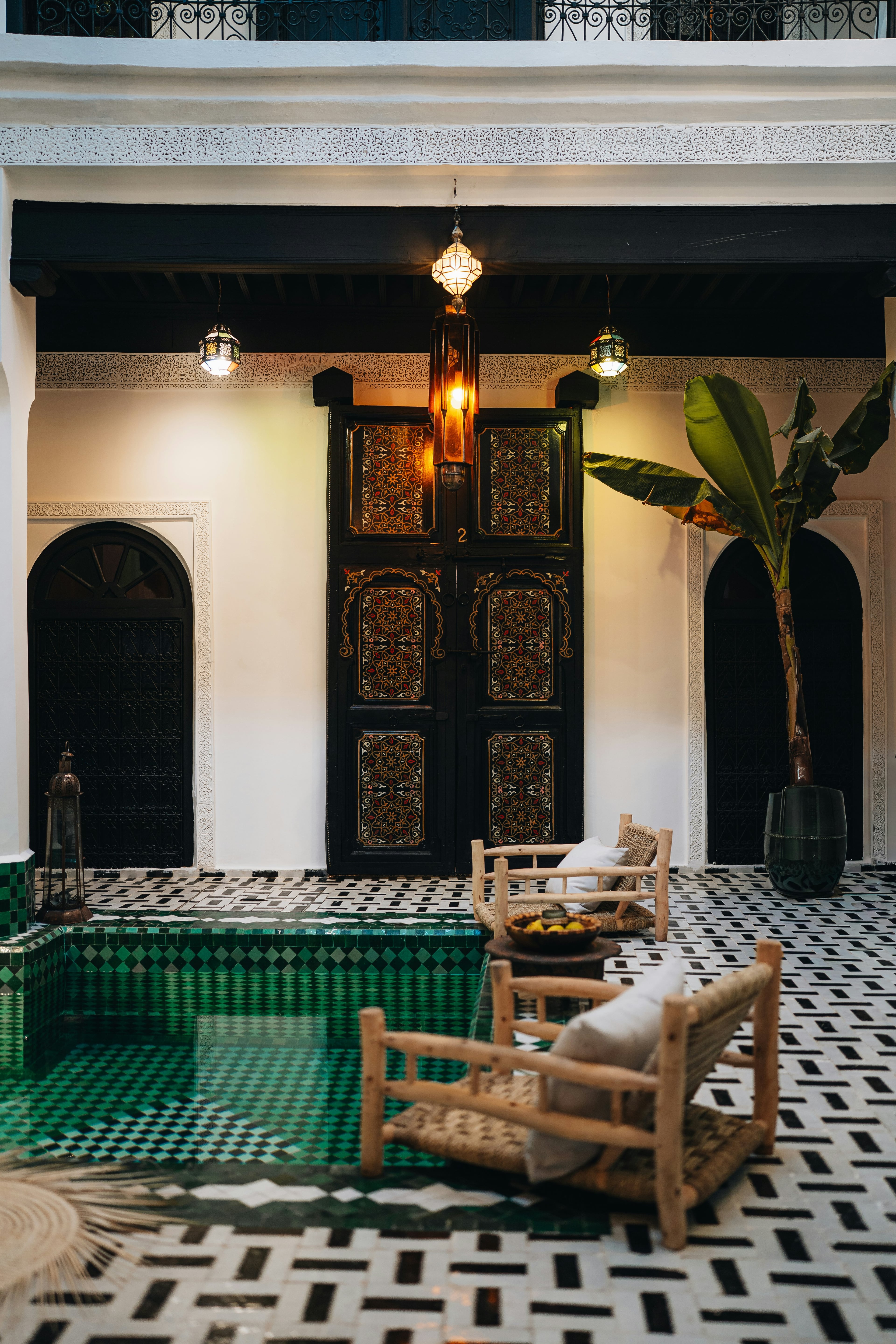 A riad courtyard lit by candles for an evening dinner