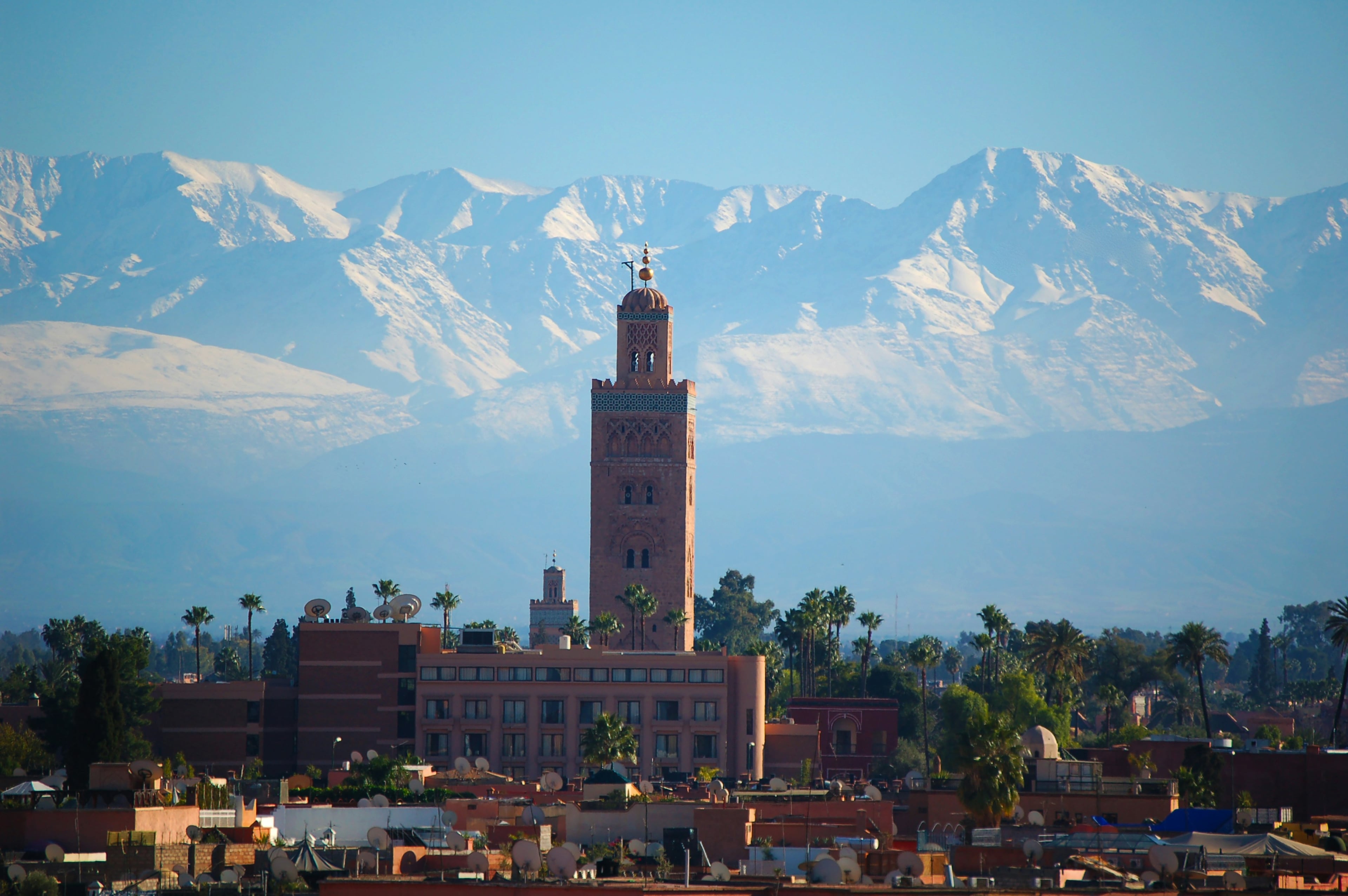 The Koutoubia minaret against the snow-capped High Atlas, Marrakech