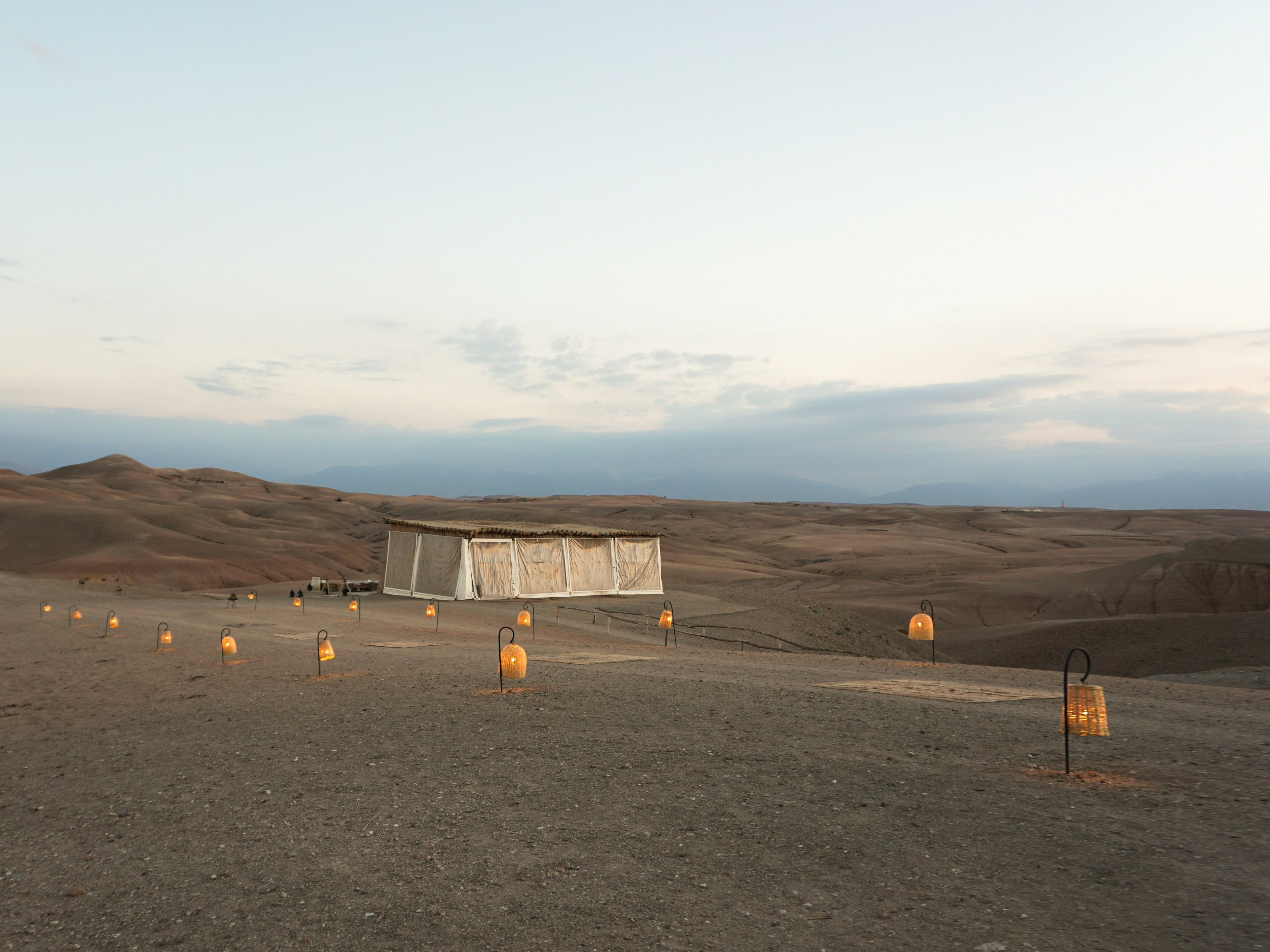 Lanterns set out on the Agafay desert at dusk